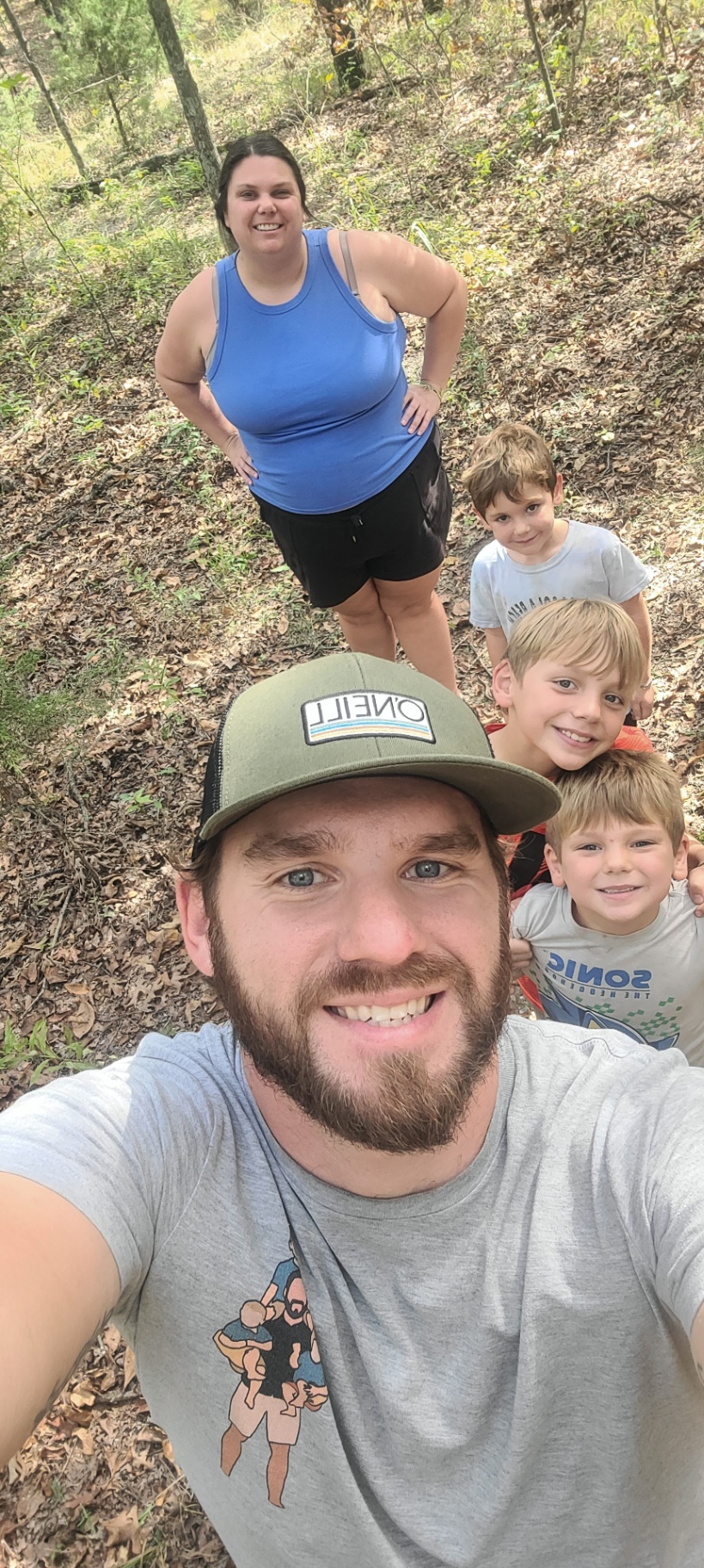 Richard on a hike with the boys and Audra